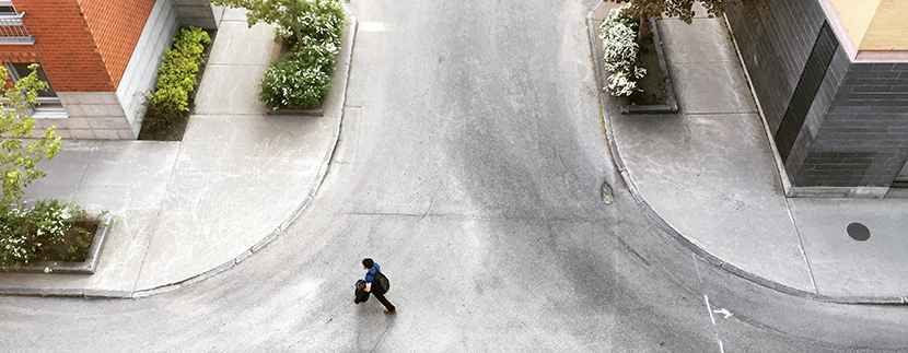 a tenant representative walking across the street