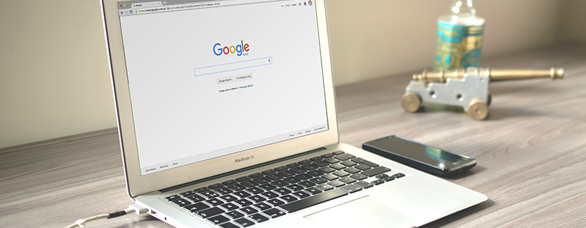 a computer with google up on the screen